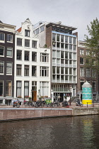 Holland, North, Amsterdam, Contrasting new and typical Dutch buildings.