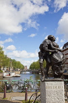 Holland, North, Amsterdam, Sculpture next to old city gate De Waag in the Nieuwmarkt neighbourhood.