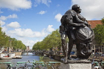 Holland, North, Amsterdam, Sculpture next to old city gate De Waag in the Nieuwmarkt neighbourhood.