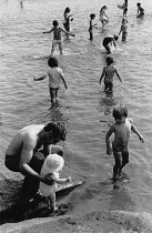 England, Cheshire, Tatton Park, Children paddling in shallow pool, 1987.