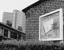 England, Merseyside, Bootle, Sign outside church with office block behind, 1975.