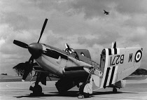 Transport, Air, Royal Navy Fairey Firefly Fighter plane with F16 flying above at air show in RAF Culdrose.