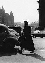 England, Merseyside, Liverpool, Woman walking in the city centre in 1968.