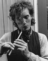 England, Cumbria, Kirby Lonsdale, Man in period costume playing tin whistle flute at Victorian Festival in 1987.