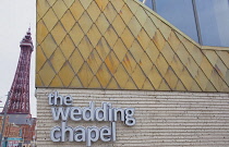 England, Lancashire, Blackpool, Seafront promenade with Wedding Chapel building and Tower behind.