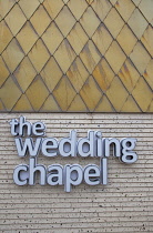 England, Lancashire, Blackpool, Seafront promenade with Wedding Chapel sign and exterior detail.
