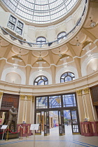England, Lancashire, Blackpool, Winter Gardens foyer interior with statue of Morcambe and Wise under glass dome.