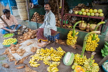 India, Tamil Nadu, Chidambaram, Banana & coconut vendors in the market at Chidambaram.