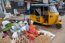 India, Tamil Nadu, Chidambaram, Peanut & yam vendor in the market at Chidambaram.