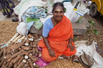 India, Tamil Nadu, Chidambaram, Peanut & yam vendor in the market at Chidambaram.