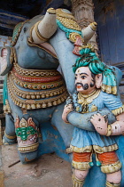 India, Tamil Nadu, Kumbakonam, Wooden carving of an elephant and its mahoot at the Nagesvara Swami Temple.