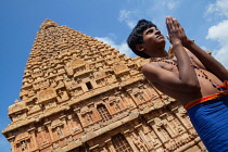 India, Tamil Nadu, Tanjore, Thanjavur, Portrait of a pilgrim praying at the Brihadisvara Temple in Tanjore.