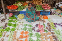 India, Tamil Nadu, Tanjore, Thanjavur, Vegetable seller in the market at Tanjore.