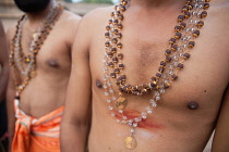 India, Tamil Nadu, Tanjore, Thanjavur, Detail of the beaded necklaces worn by pilgrims at the Brihadisvara Temple in Tanjore.