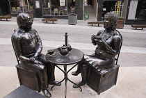 Malta, Sliema, Metal sculpture, old couple drinking tea.