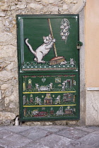 Italy, Sicily, Taormina, Small painted metal door.