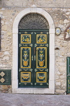Italy, Sicily, Taormina, Ornately painted front door.