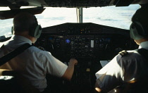 Transport, Air, Cockpit, Pilots on flightdeck during flight.