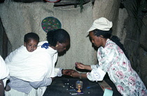 Eritrea, Zager Village, Woman with child on back voting during referendum for independence from Ethiopia, Indelible ink marks voters hand.