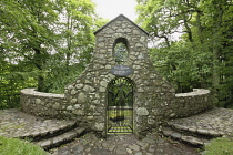 Wales, Caernarfonshire, Llanystumdwy, Monument for David Lloyd Georgewith stone surround and ornamental iron gate.