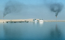 Qatar, General, Gas oil installation on the coast at the edge of the desert.