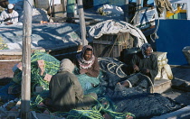 Qatar, General, Fishermen mending nets.