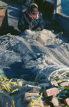 Qatar, General, Fisherman mending nets.