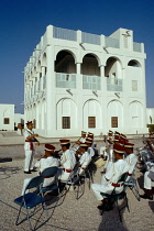 Qatar, Doha, Exterior of Museum with military band playing at opening.