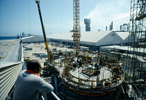 Qatar, Work, Construction site with workers on scaffolding.