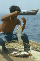 Qatar, Industry, Fisherman with his catch.