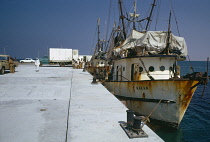 Qatar, Industry, Fishing boats moored in dock.