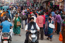 India, Uttar Pradesh, Varanasi, Pedestrians and road users on Dasashwamedh Ghat Road.