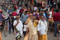 India, Uttar Pradesh, Varanasi, Pedestrians and road users on Dasashwamedh Ghat Road.