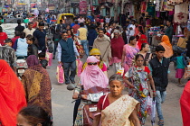 India, Uttar Pradesh, Varanasi, Pedestrians and road users on Dasashwamedh Ghat Road.