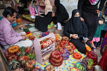 India, Uttar Pradesh, Faizabad, Muslim women buying bangles in a shop in .