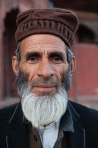 India, New Delhi, Portrait of a muslim man at the Jama Masjid.