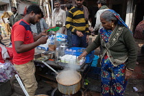 India, New Delhi, Chai vendor in the old city of Delhi.