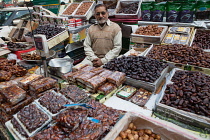 India, New Delhi, Date vendor in the spice market in the old city of Delhi.