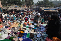 India, New Delhi, Vendor selling muslim headwear in the cotton market in the old city of Delhi.