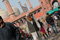 India, New Delhi, A muslim man walks through the streets of the old city of Delhi in front of the Jama Masjid.