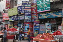 India, New Delhi, Advertisement boards and hoardings for travel services in the Paharganj district of Delhi.