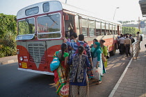 India, Mumbai, Passengers board a bus outside Chhatrapati Shivaji International Airport.