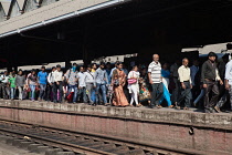 India, West Bengal, Kolkata, Commuters head for the exit at Howrah Railway Station.