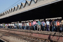 India, West Bengal, Kolkata, Commuters head for the exit at Howrah Railway Station.