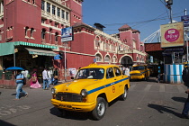India, West Bengal, Kolkata, Taxi in front of Howrah Railway Station.