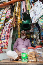 India, West Bengal, Kolkata, Muslim shopkeeper.