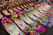 India, West Bengal, Kolkata, Display of traditional ladies footwear mojaris and jootis in a shop in New Market.