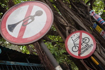 India, West Bengal, Kolkata, Road signs for no horns and no cycling on Park Street.