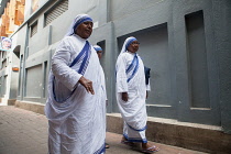India, West Bengal, Kolkata, Missionaries of Charity sisters and nuns in the street outside the Mother's House.