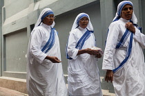 India, West Bengal, Kolkata, Missionaries of Charity sisters and nuns in the street outside the Mother's House.
